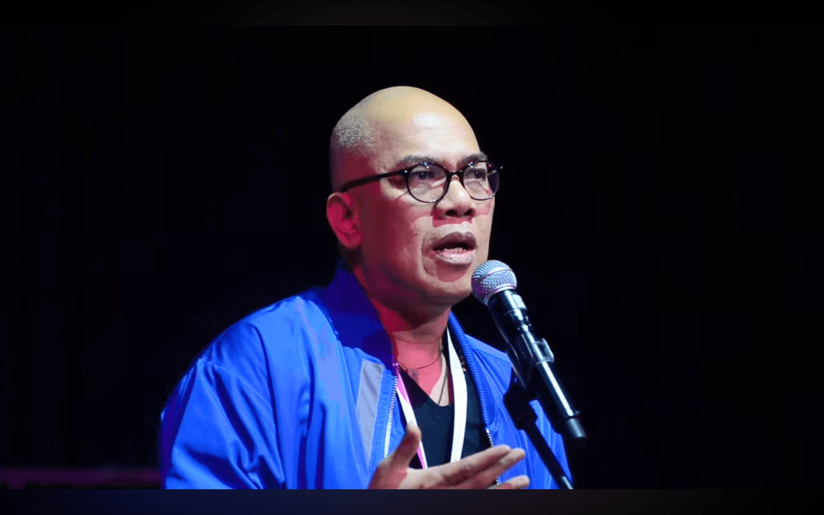 Boy Abunda speaking into a microphone during his TEDx talk.